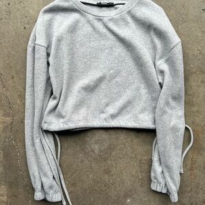 colin's Grey cropped sweatshirt with long sleeves and tie strings size small